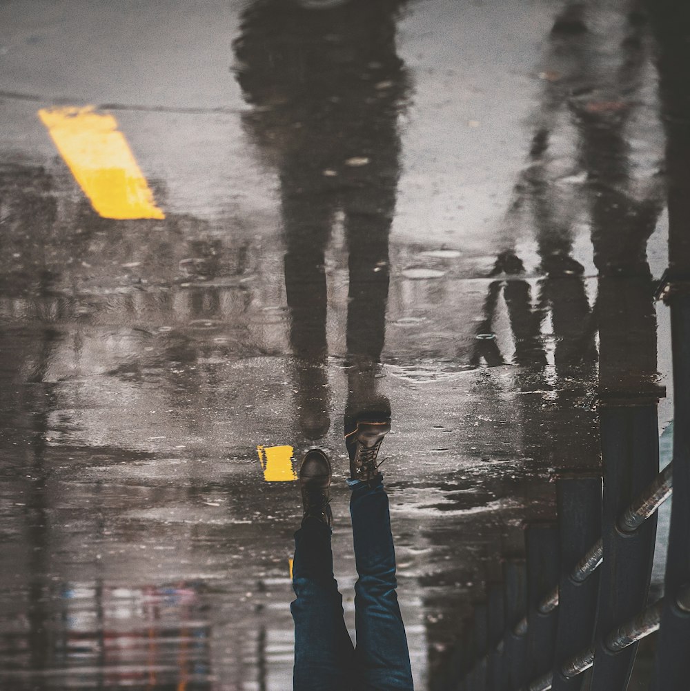 a man holding a yellow umbrella