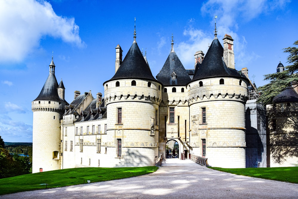 a large white castle with Château de Chaumont in the background