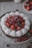 a cake with berries on top
