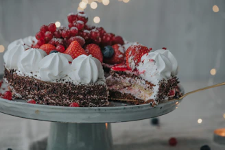 Close-up of a beautifully decorated chocolate cake with fresh berries on top