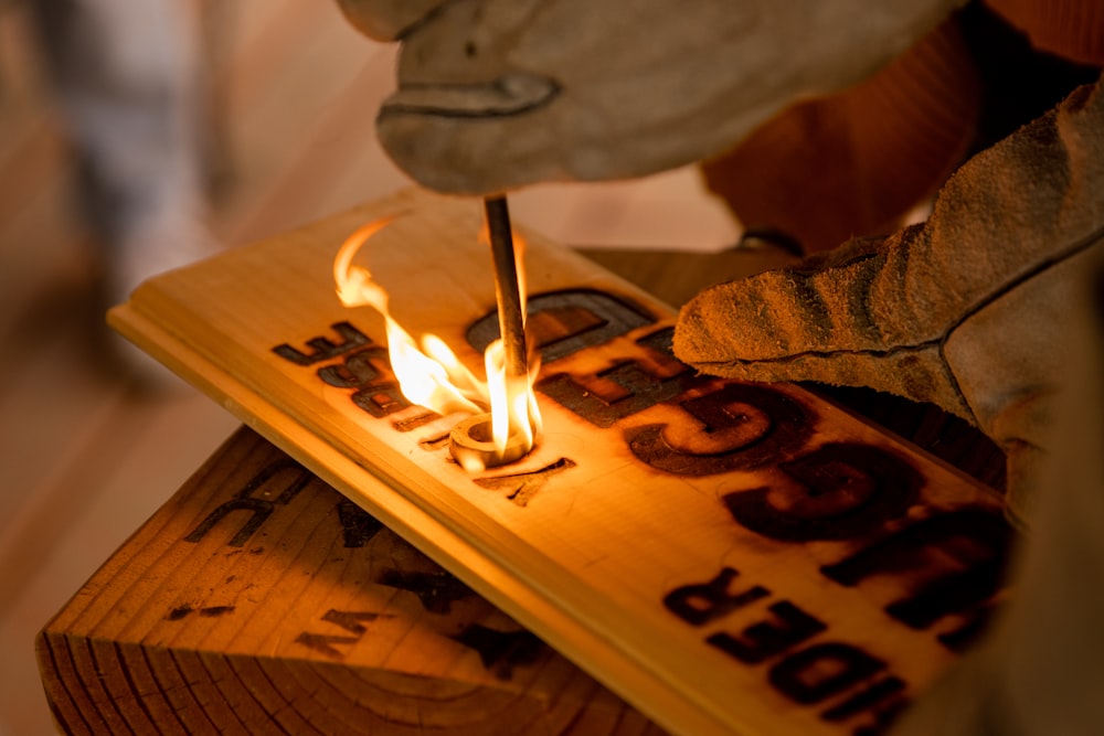 a person using a flame to put out a fire