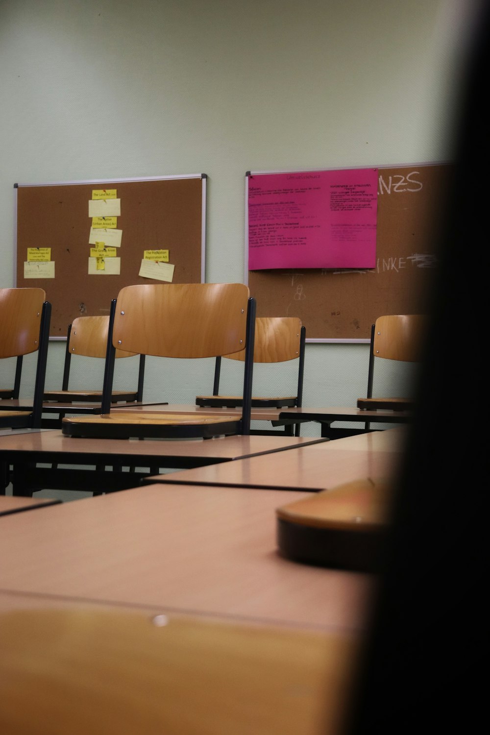 a classroom with a whiteboard and chairs