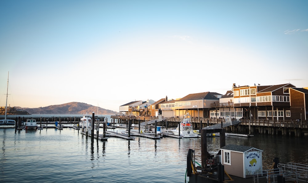 a dock with boats and buildings