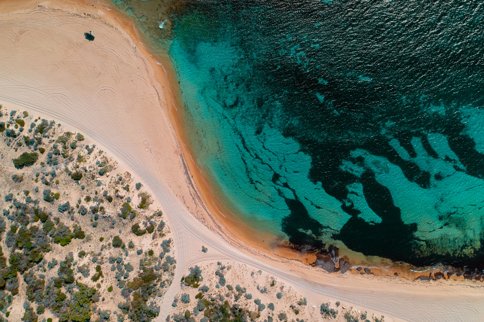 Aerial view of the Mandurah coastline, turquoise water and coastal greenery
