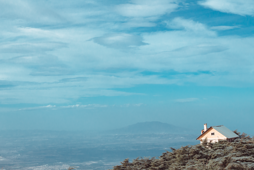 a house on a cliff overlooking the ocean