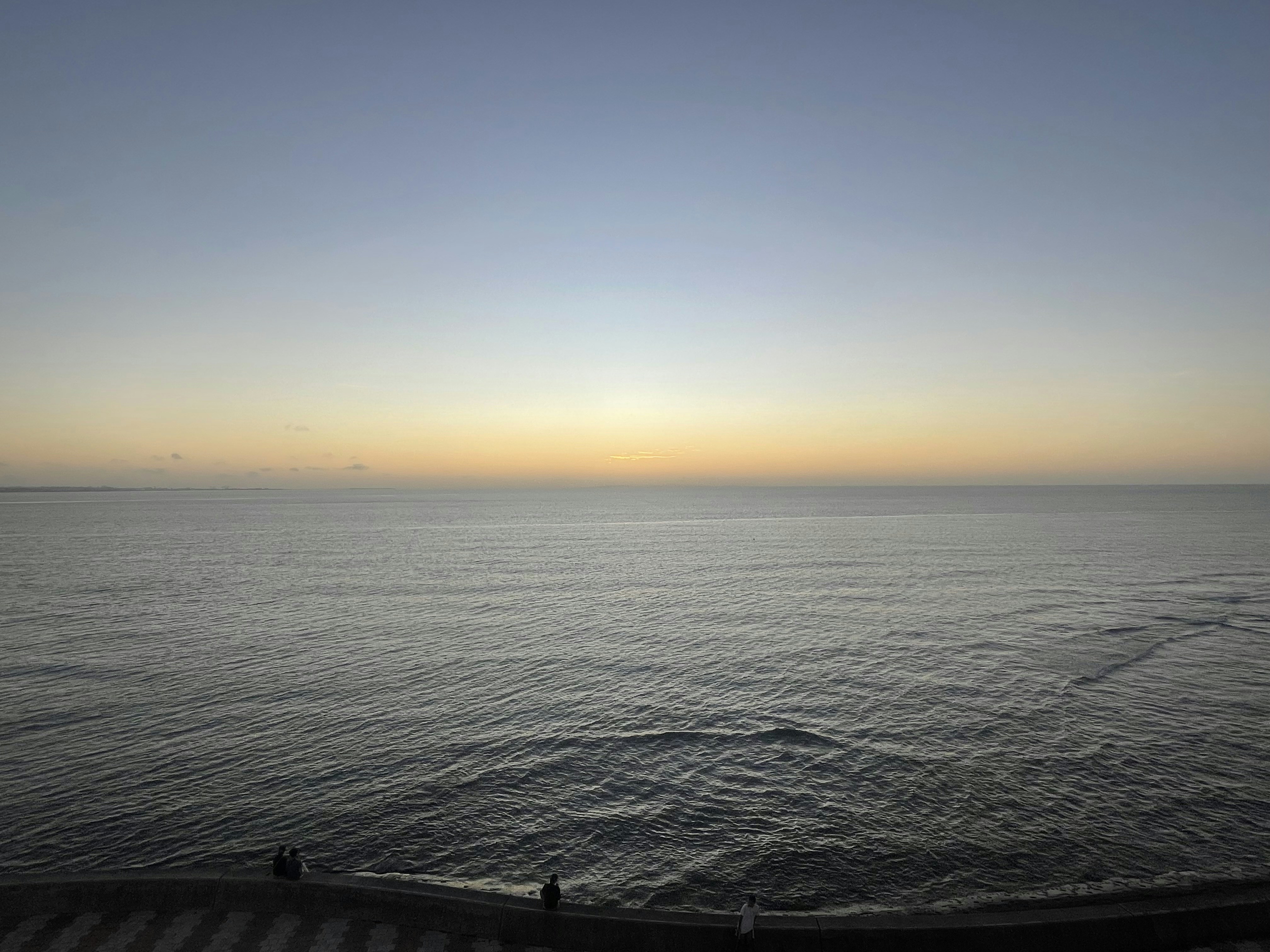 a body of water with a sunset