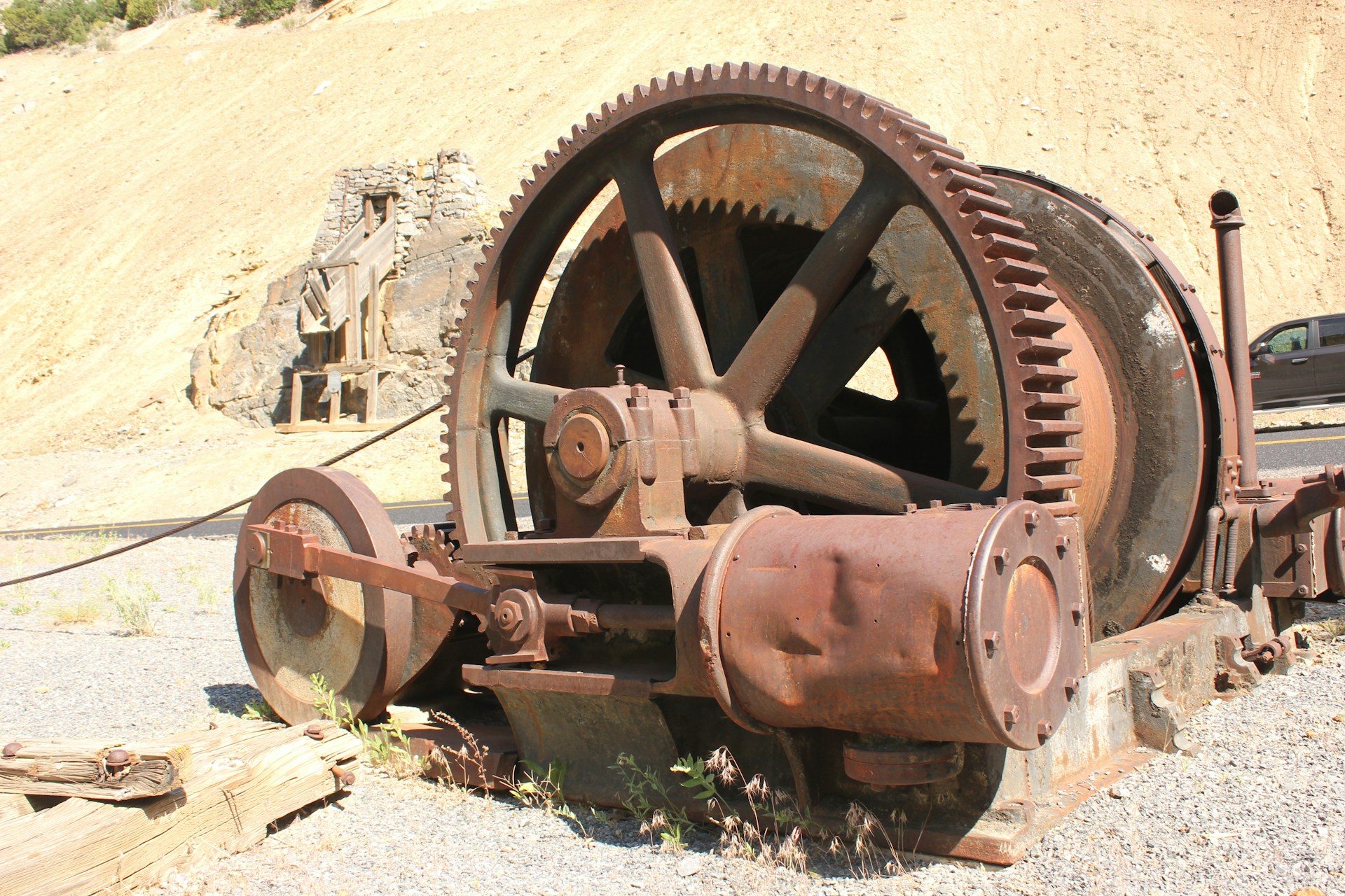 a rusted wheel on a wall