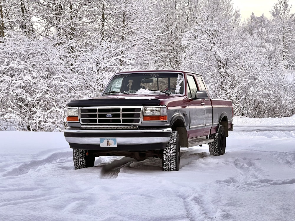 a truck driving through the snow