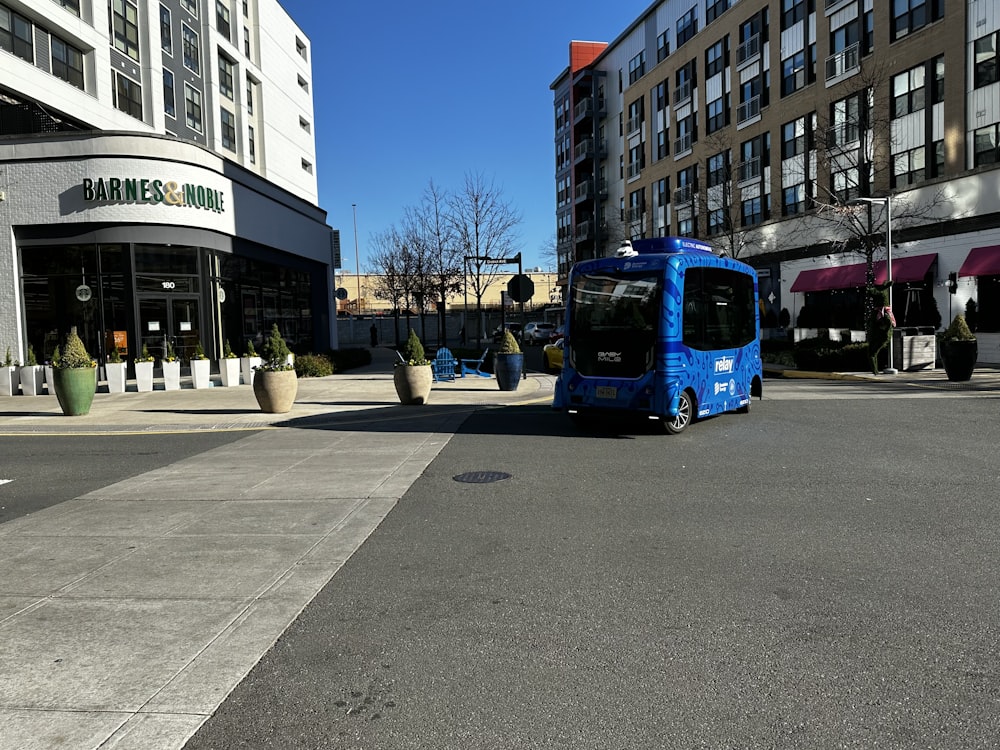a blue bus on the street