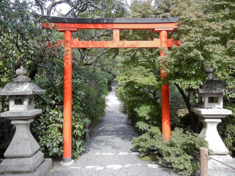 a japanese shrine with red pillars