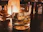 A sleek whiskey glass set displayed on a polished wooden bar with soft ambient lighting.