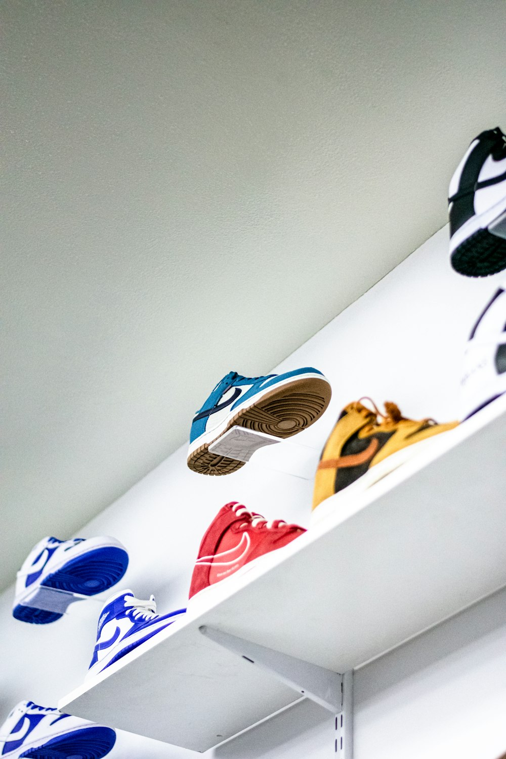 a group of shoes on a shelf
