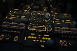 A sleek control panel with illuminated digital displays and switches.