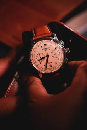 Artisan hands carefully crafting a luxury watch strap in a serene workshop environment.