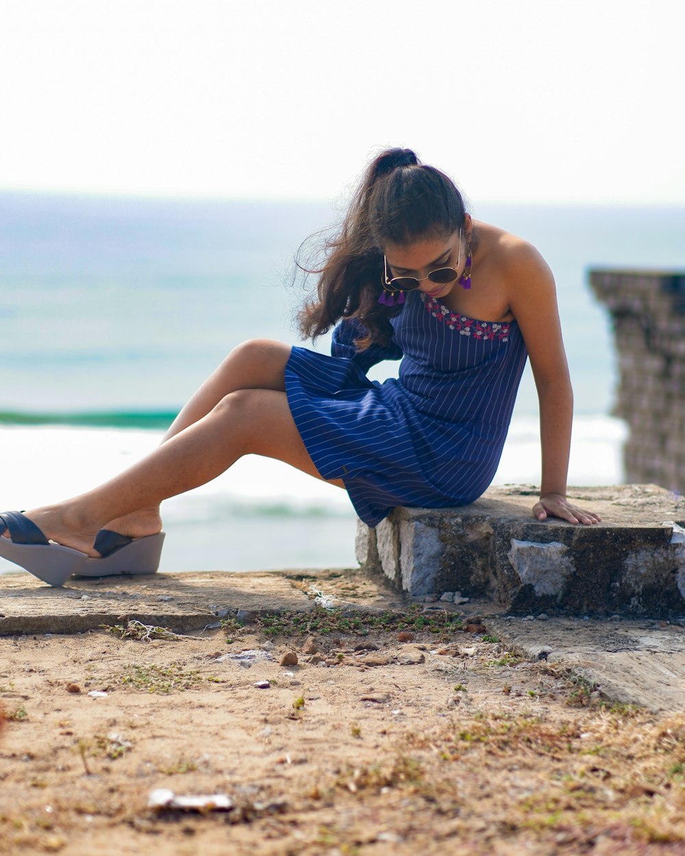 a person sitting on a rock