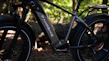 Close-up of a Voltura electric bike wheel in motion on a forest trail