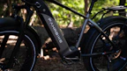 Close-up of a Voltura electric bike wheel in motion on a forest trail