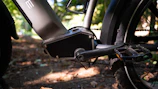 Close-up of tandem bike pedals and chain in motion