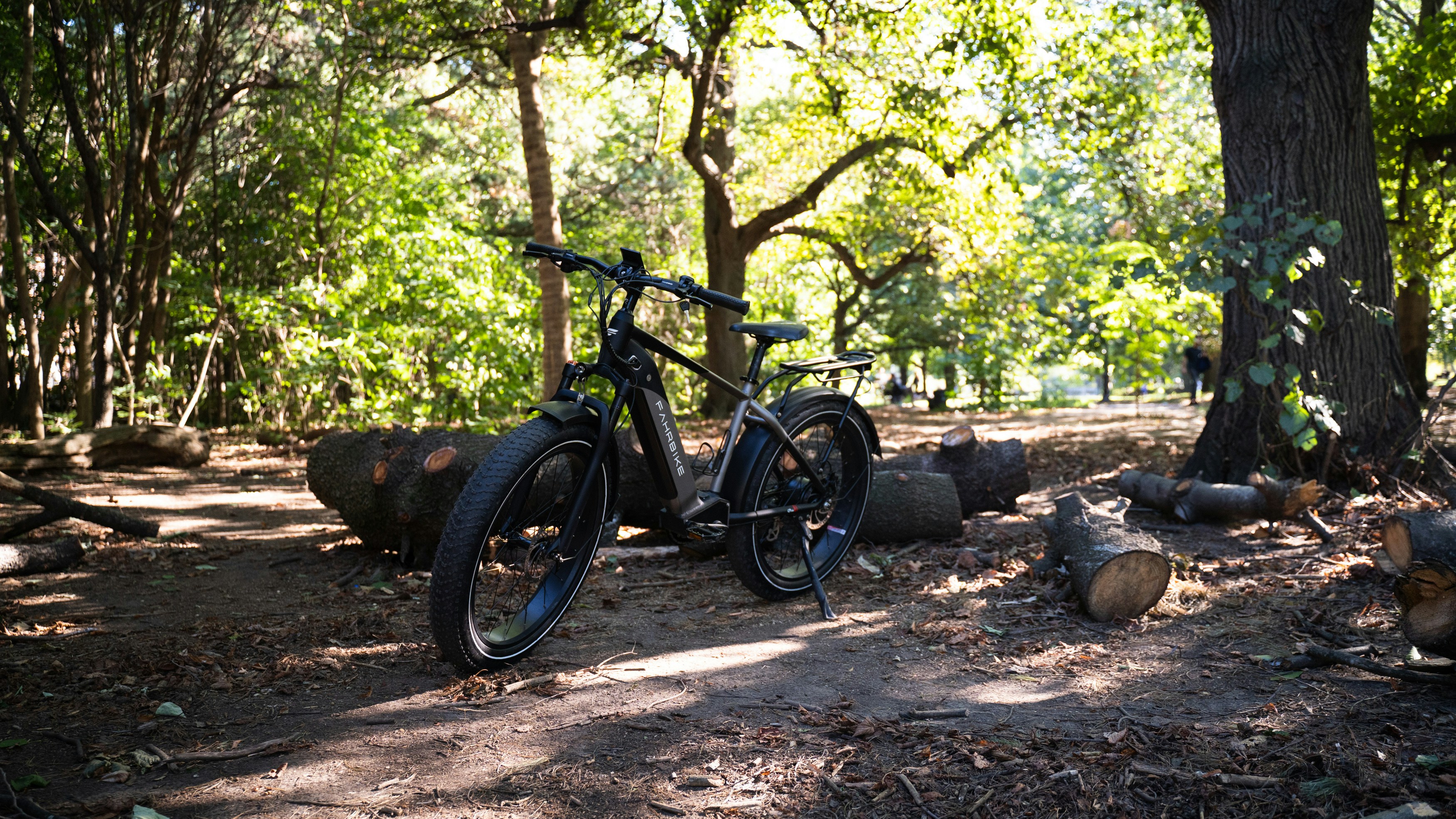 a bike parked in a wooded area