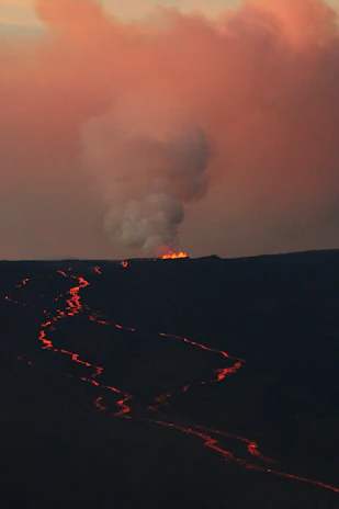 A detailed 3D model of a volcanic eruption with glowing lava flows and ash clouds.