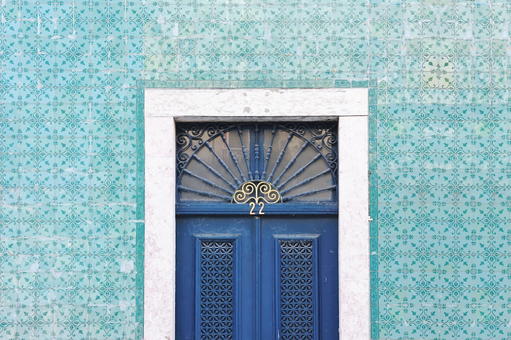 a blue door with a gold emblem
