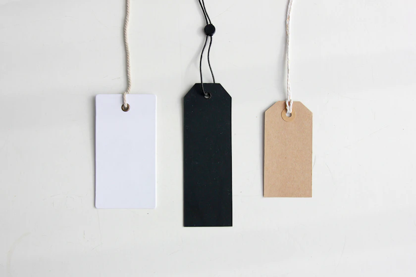 A small consumer product photographed beside its plain white retail carton.
