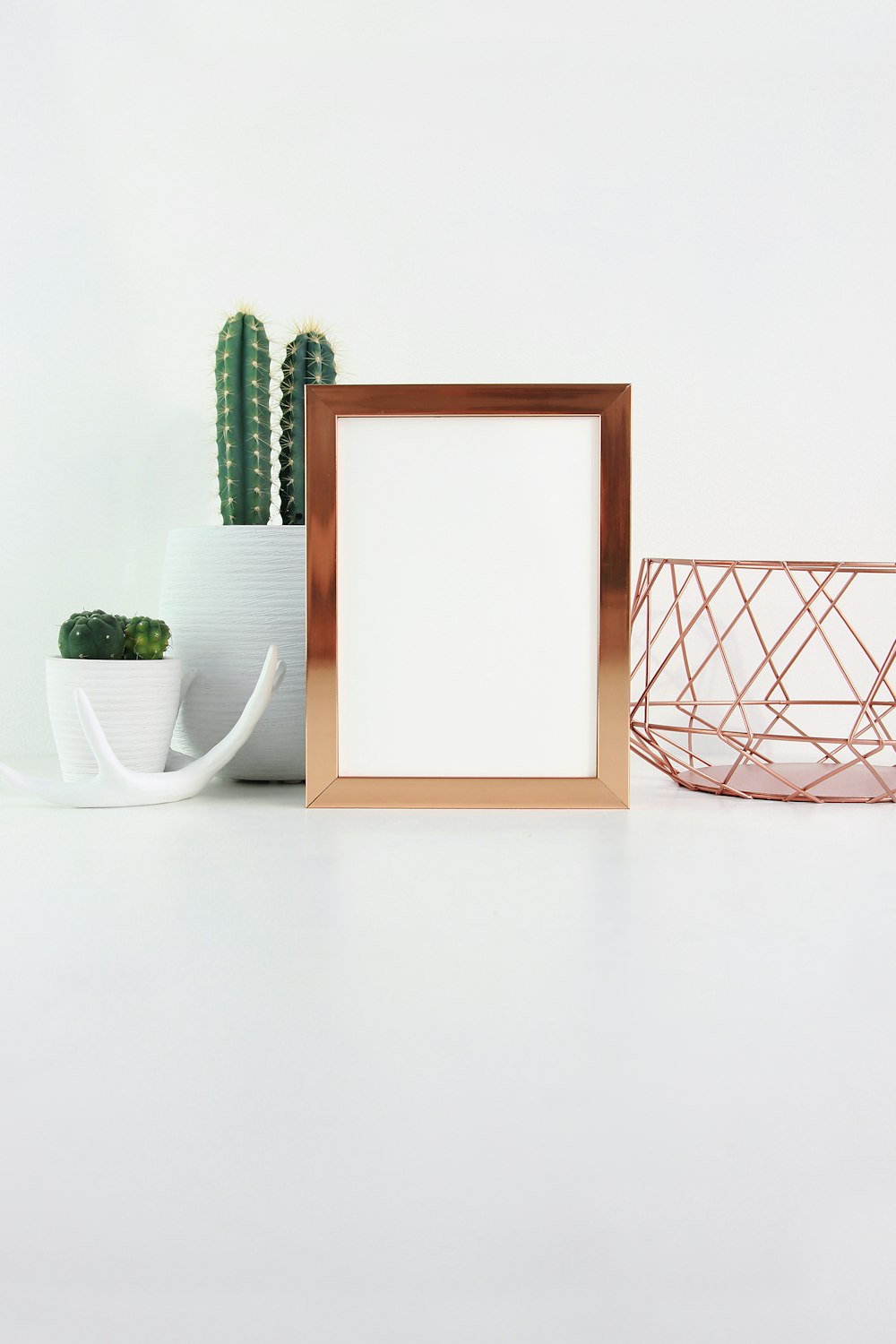 a wooden frame with a plant in it