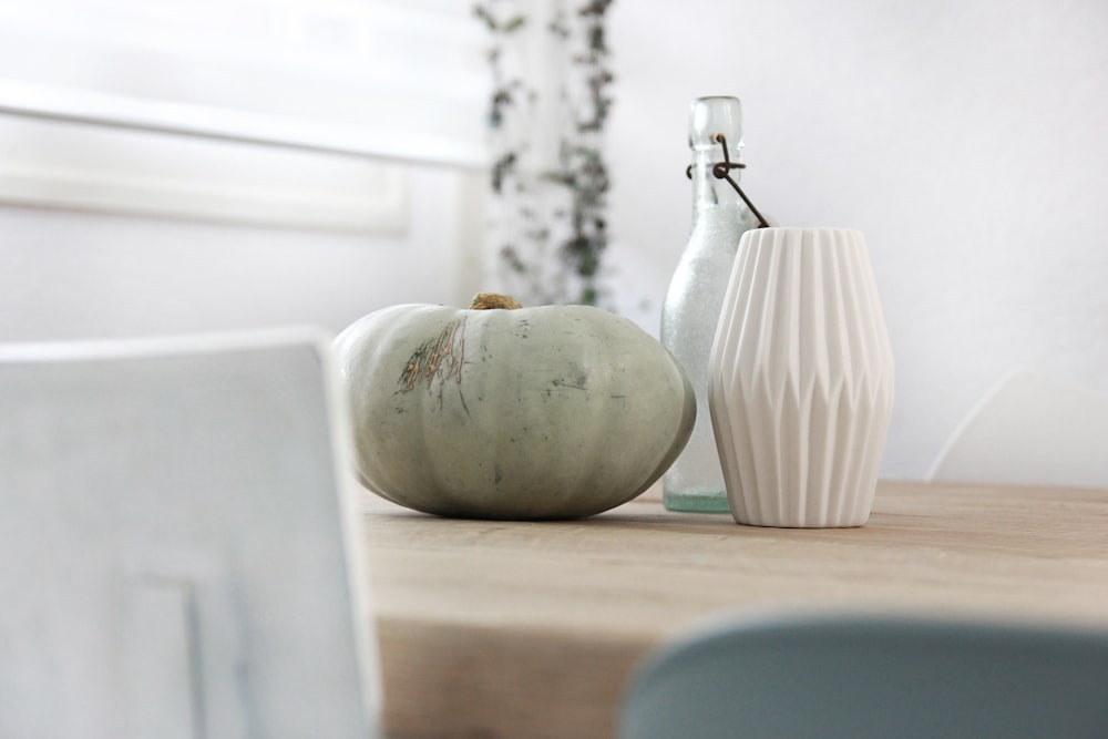 a vase and a pitcher on a table