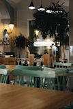 a restaurant with green tables