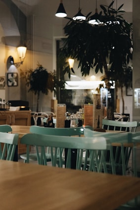 a restaurant with green tables
