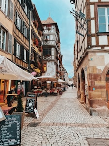 a cobblestone street with buildings on either side of it