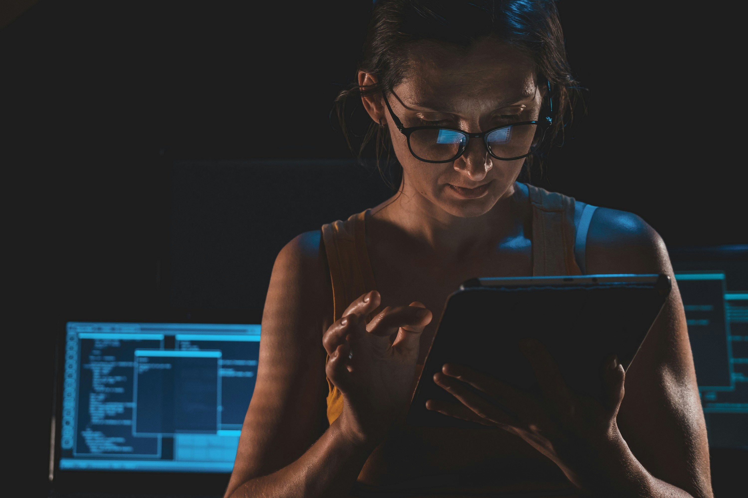 cybersecurity engineer analyzing code on monitor screen