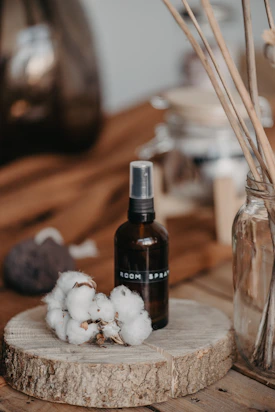 a bottle of wine next to a pile of garlic