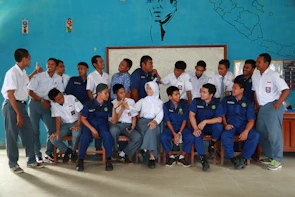 A group of international students smiling together during orientation day