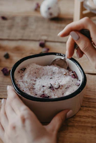 a person holding a cup of coffee