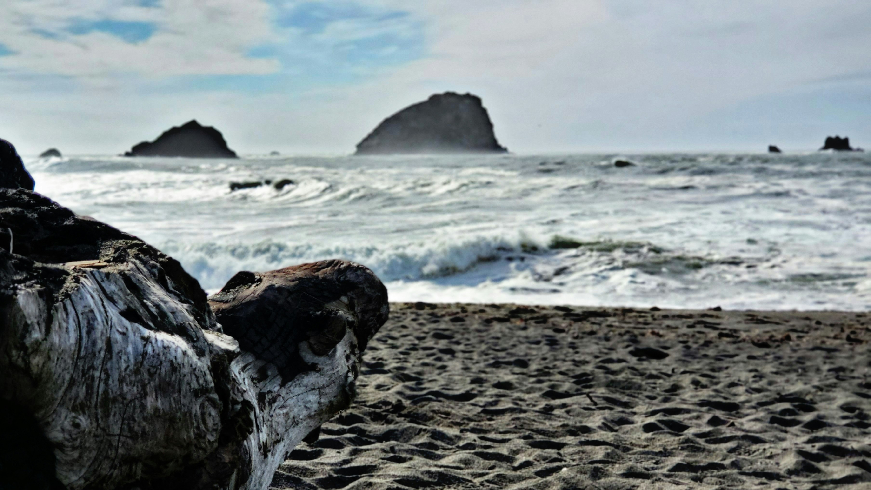 a beach with waves crashing on it