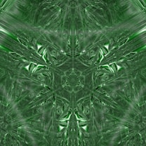 An intricate fractal pattern consisting of symmetrical shapes and lines. The design is primarily green, giving it a futuristic and abstract feel. The pattern consists of interwoven, shiny, metallic-like surfaces that create a sense of depth and complexity.