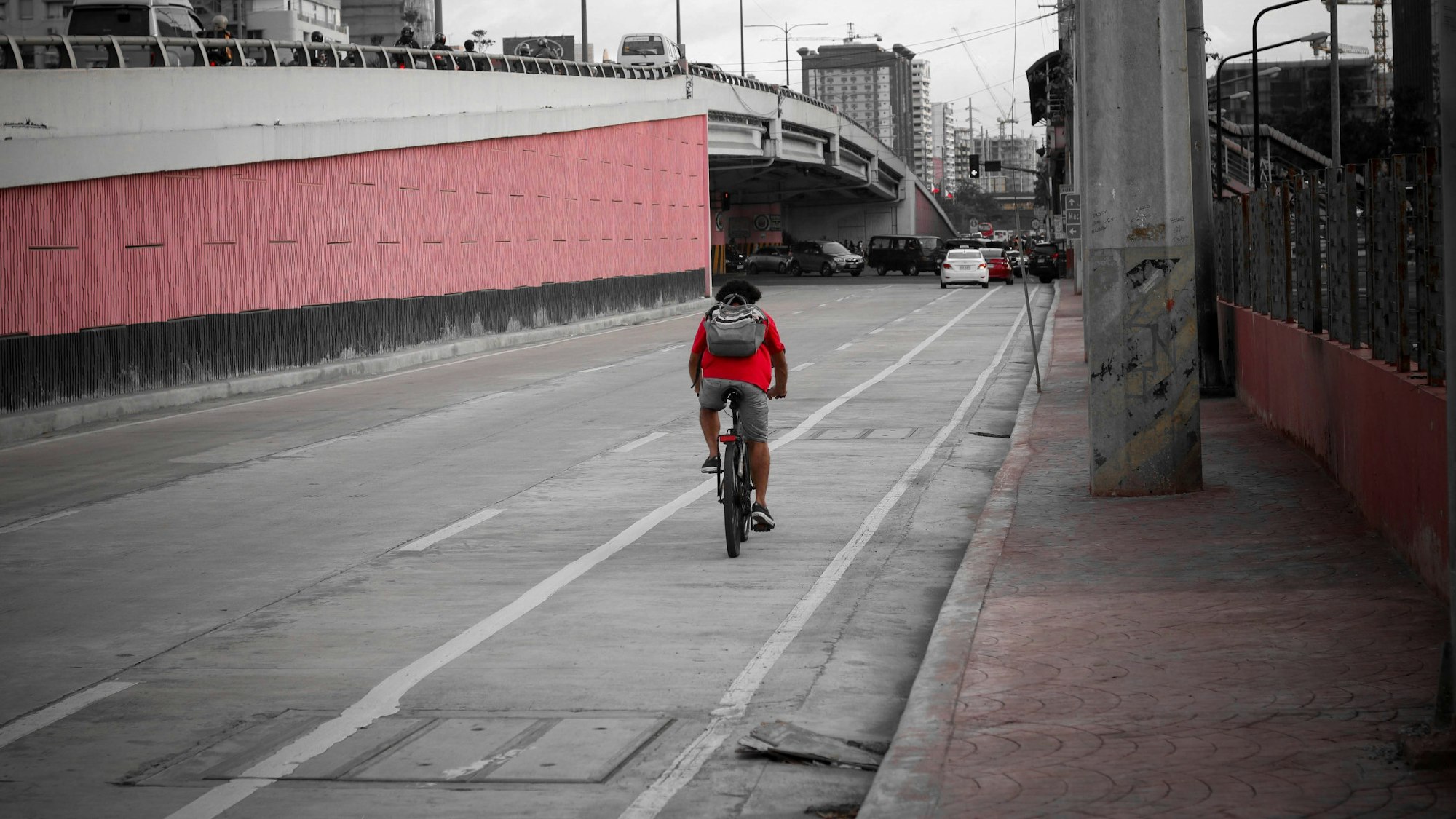 a person riding a bicycle on a road