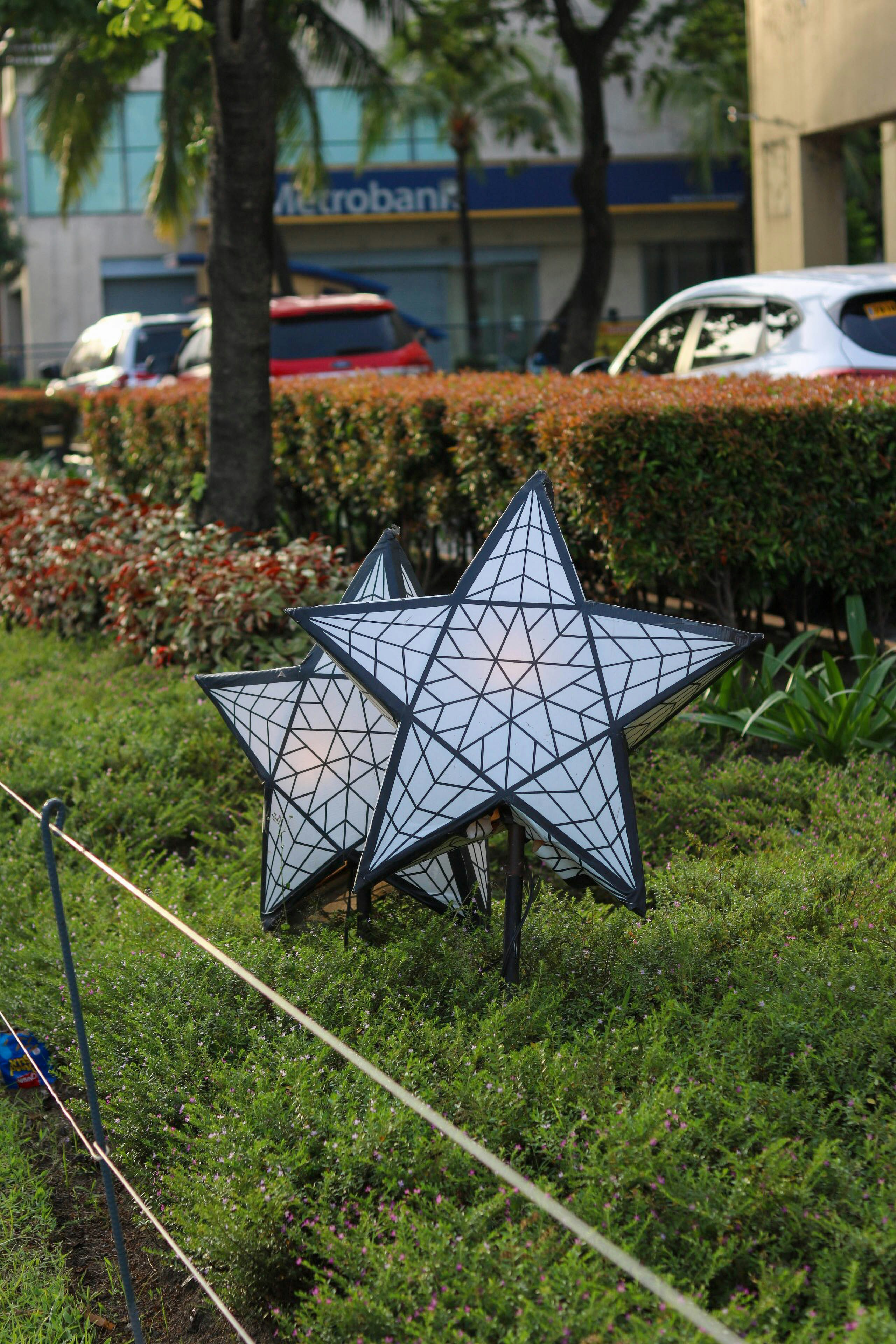 a blue and white umbrella in a garden
