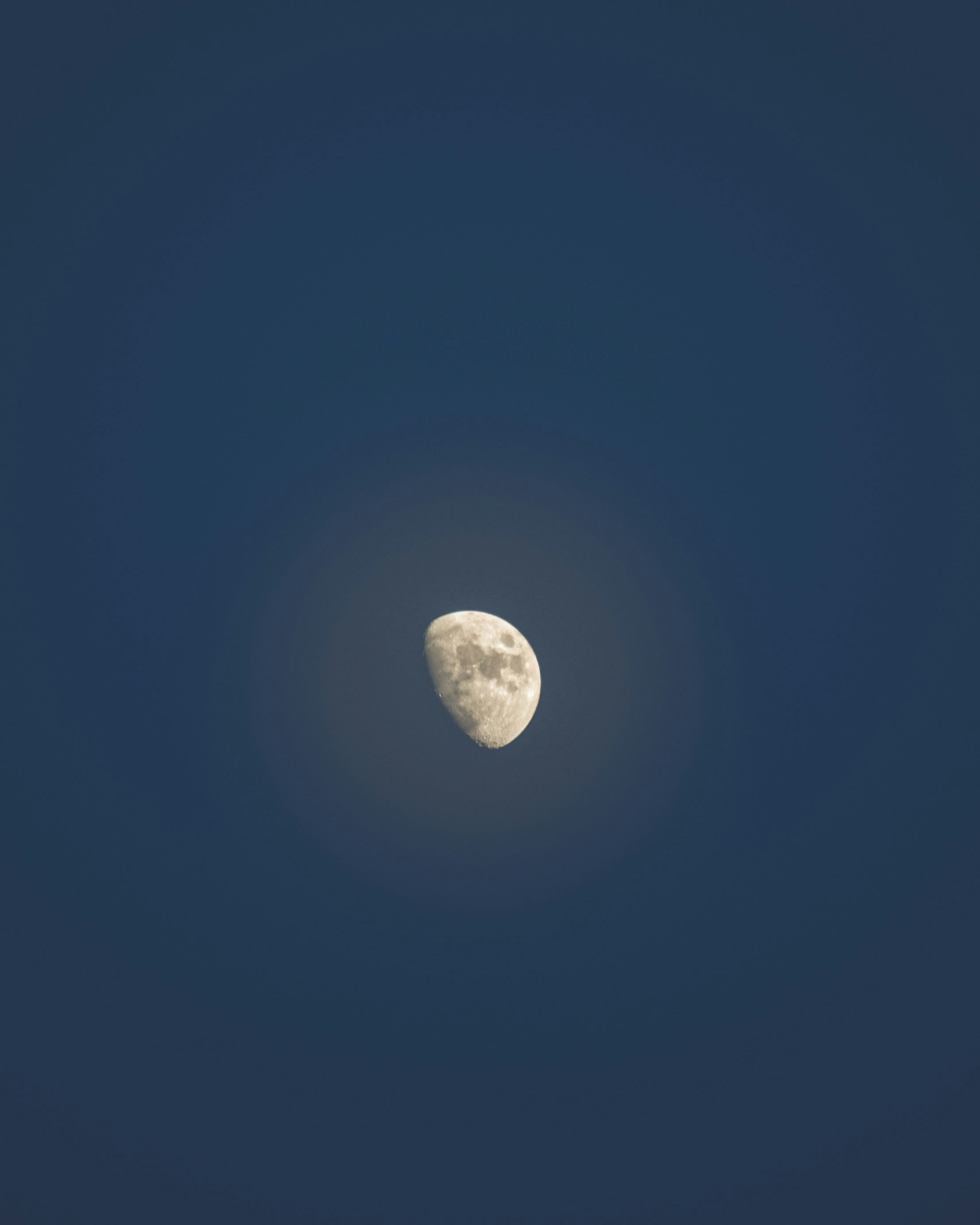 a moon in a blue sky