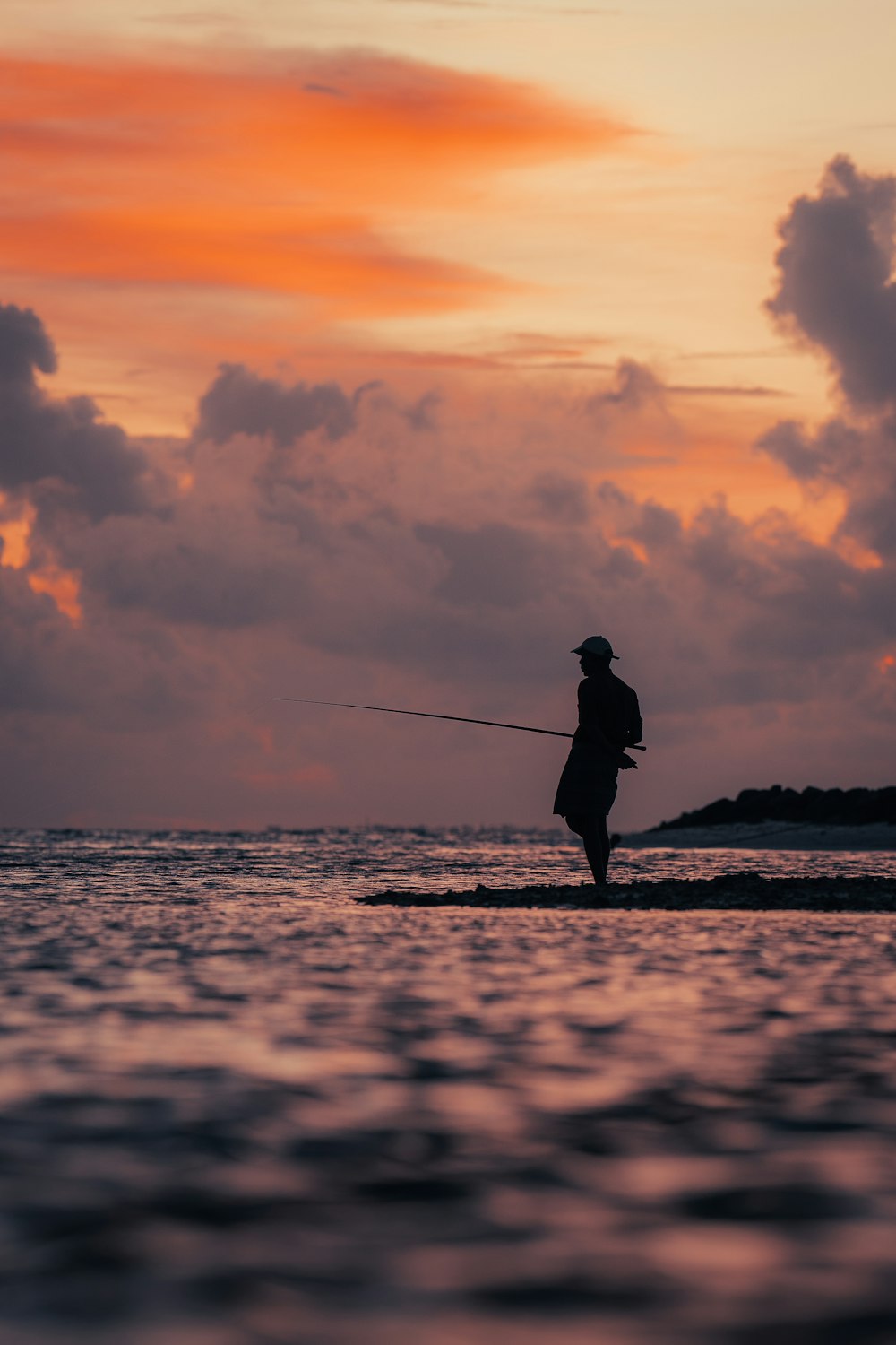 a man fishing on a beach