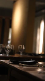 a table with glasses and plates on it