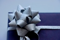 Close-up of a kraft paper gift box with a rustic twine bow.