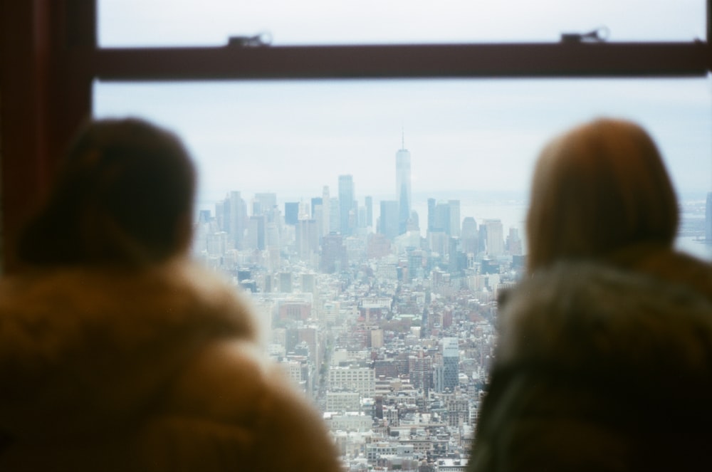 people looking out a window