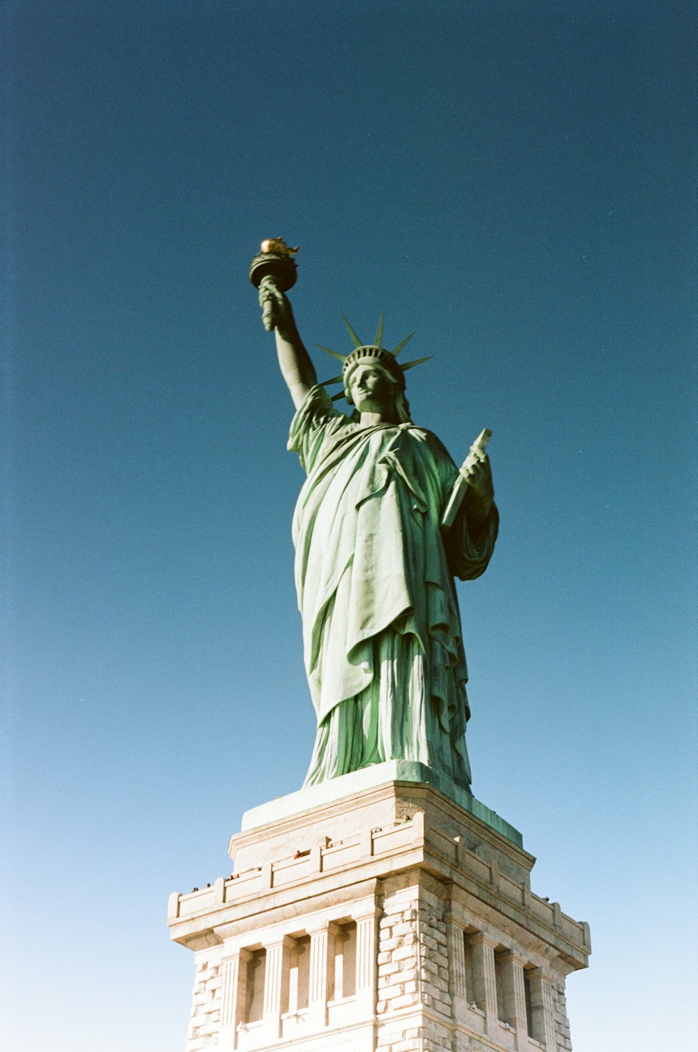 a statue of a person holding a torch