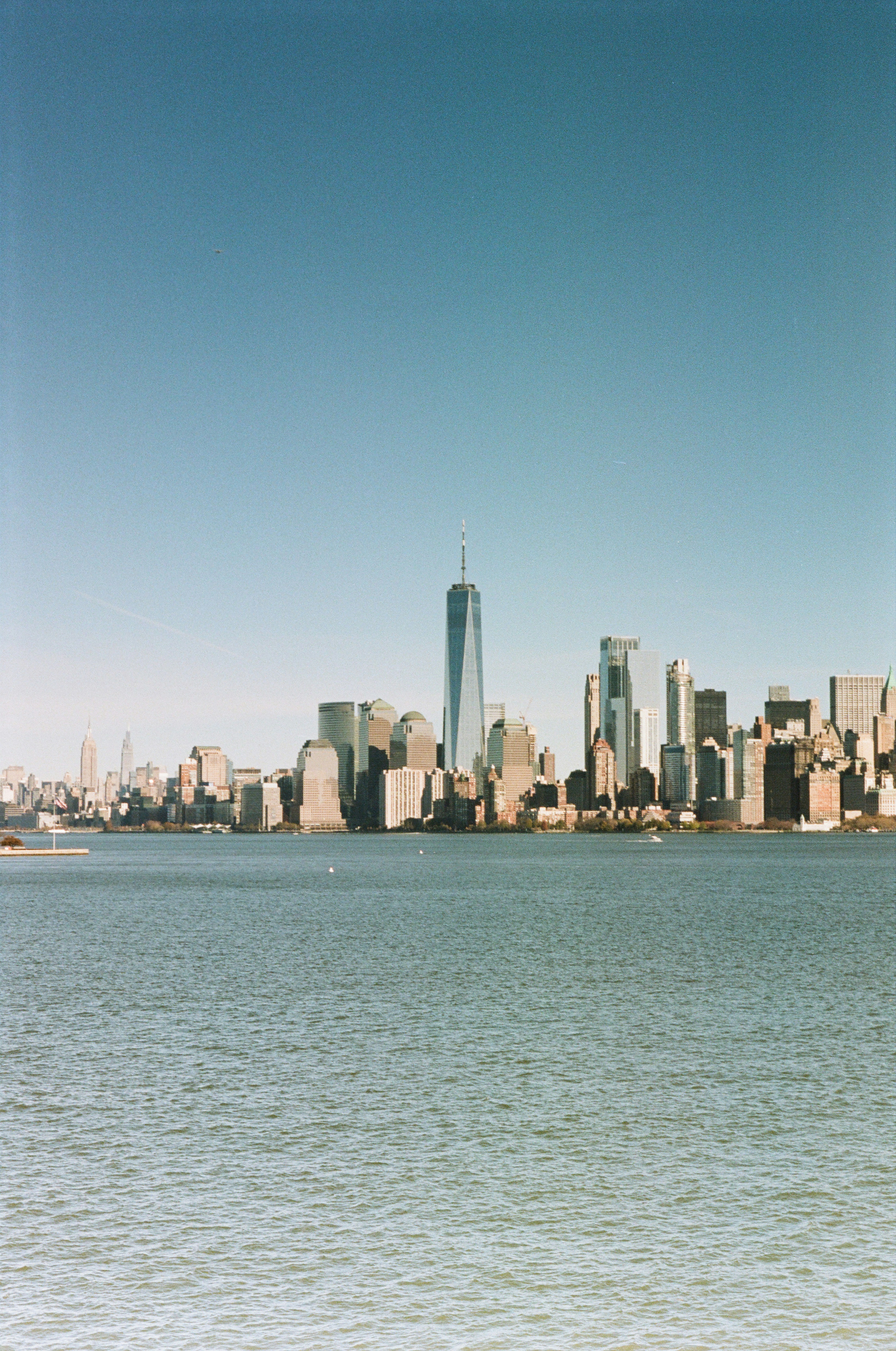 A city skyline across the water photo – Free New york Image on Unsplash