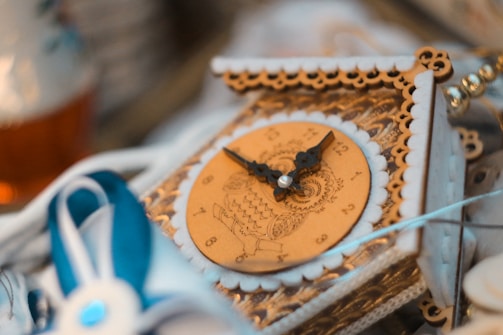 A beautifully engraved wooden clock with intricate designs.