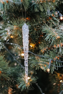 Close-up of delicate snowflake LED lights twinkling against a winter backdrop