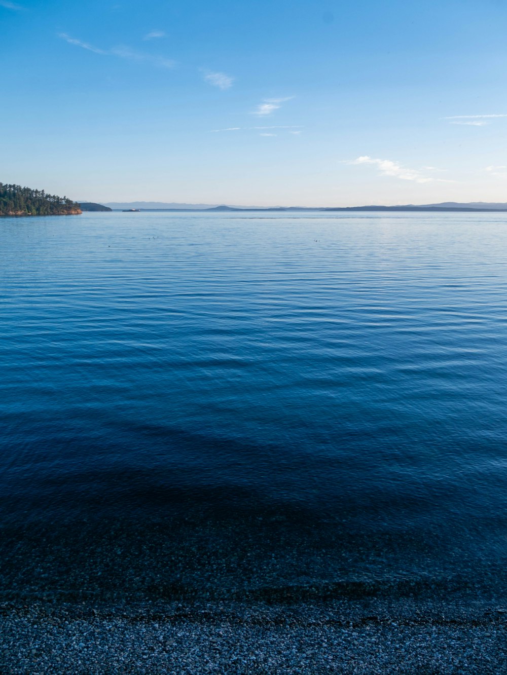 a body of water with land in the distance