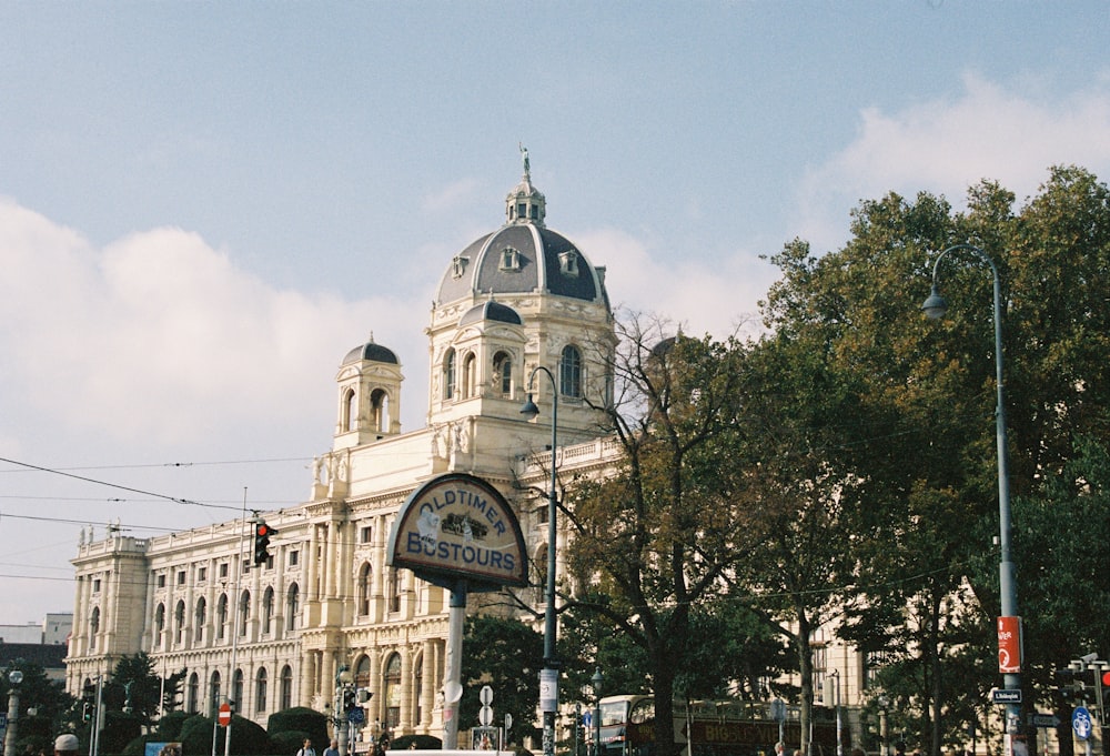 a large building with a dome and a sign on it